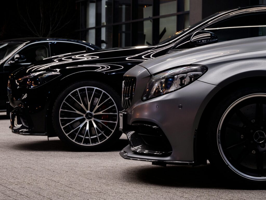 Close-up of luxury Mercedes cars parked in Wrocław, showcasing sleek design and shiny rims.